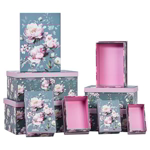 a bunch of boxes with pink flowers on them