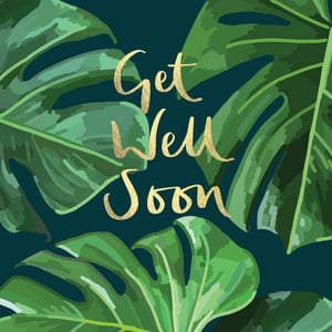 a get well soon card with tropical leaves on a dark background