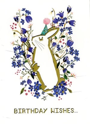 a birthday card with a rabbit wearing a party hat surrounded by blue flowers .