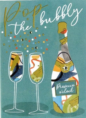 a bottle of prosecco sits next to two glasses