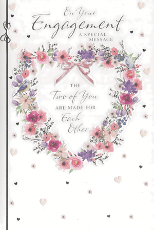 Congratulate the happy couple with this truly beautiful Engagement card, brought to you by Simon Elvin. The front of this exquisite card showcases a captivating heart-shaped floral wreath, adorned with a delightful mix of pink, purple, and white blossoms, complemented by lush green foliage. A sweet little bird and a charming pink bow add a touch of romance to the design. The heartfelt message "On Your Engagement, The Two of You Are Made For Each Other" is beautifully displayed, sure to convey your warmest wishes. Finished with delicate scattered hearts and tiny flowers, this card offers an elegant way to celebrate. Available in a convenient pack of 6, you'll be perfectly prepared for every engagement celebration.