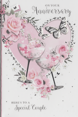 Mark the special occasion with our elegant 'Your Wedding Anniversary' card, crafted by Simon Elvin. This lovely design showcases a soft pink heart motif, beautifully embellished with delicate pink roses, lush foliage, and graceful butterflies. Two stylish champagne flutes, brimming with sparkling details and tiny hearts, create a celebratory feel. The card features the warm messages "ON YOUR Anniversary" and "HERE'S TO A Special Couple," making it a thoughtful choice for any anniversary celebration. With its charming embossed textures and subtle glitter accents, this card offers a premium look and feel. Stock up with our convenient pack size of 1x6, ensuring you have this delightful card ready for your customers.