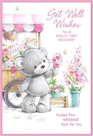 a teddy bear is holding a flower in front of a cart of flowers .