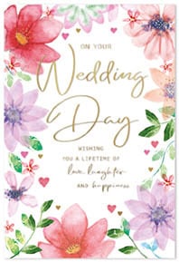 a wedding day card with flowers and hearts on it