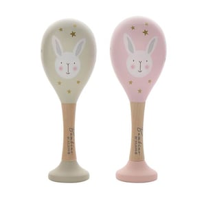 two wooden maracas with bunny faces on them