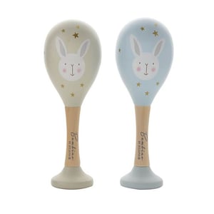 two wooden maracas with bunny faces on them
