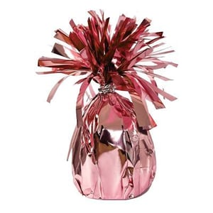 a pink balloon weight wrapped in pink foil on a white background .