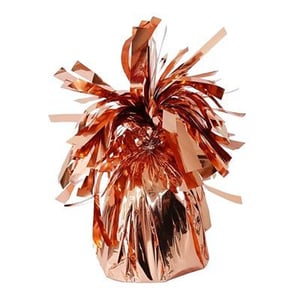 a rose gold balloon weight with tinsel on a white background .