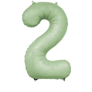 a green balloon in the shape of the number 2