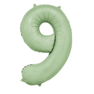 a green balloon in the shape of the number 9