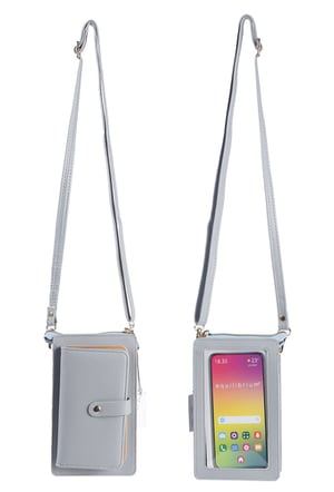 a grey purse with a cell phone inside of it