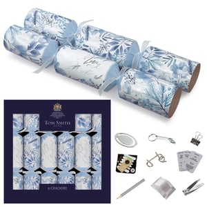 Add a touch of winter elegance to your festive celebrations with our 6 x 14" Foliage Premium Crackers. These beautiful crackers feature a sophisticated blue and white foliage design, with some adorned with elegant 'Merry Christmas' script. Each cracker is tied with a delicate blue ribbon, making them a stunning addition to any Christmas table. From the renowned Tom Smith brand, established in 1847, you can expect quality and tradition.
Inside, each cracker holds a premium gift. Discover delightful surprises like a handy bookmark, a fun metal puzzle, a practical keyring bottle opener, or a mini sewing kit. This pack of six ensures everyone gets a charming treat, perfect for creating memorable moments around the Christmas table.