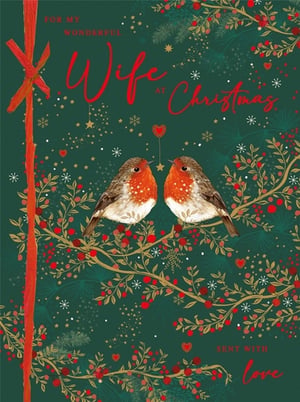 Help your customers celebrate their wonderful wives this Christmas with this charming card from Nigel Quiney Publications. The design features two sweet robins perched on a branch, surrounded by festive foliage, red berries, and golden accents. A deep green background sets the scene, enhanced by delicate snowflakes, stars, and small hearts, evoking a cosy winter feel. The heartfelt message "FOR MY WONDERFUL Wife at Christmas" is beautifully scripted, concluding with "SENT WITH love". This card offers a warm way to convey affection during the festive season. Supplied in a practical pack of 3, it's an ideal addition to your seasonal card selection.
