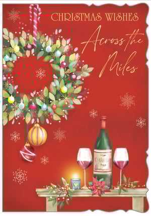 Send heartfelt festive greetings with our charming 'Across The Miles' Christmas card. This beautiful design captures the spirit of the season with a vibrant red background adorned with delicate snowflakes. A lush Christmas wreath, decorated with colourful baubles and a candy cane, takes pride of place. Below, a cosy scene unfolds on a mantelpiece, featuring a bottle of wine, two inviting glasses, a glowing candle, and a festive poinsettia. It’s the perfect way to convey warm wishes and connection to loved ones, no matter the distance. Supplied by Out of The Blue Studios Ltd, each pack contains 6 cards, ready to bring joy to your customers this Christmas.
