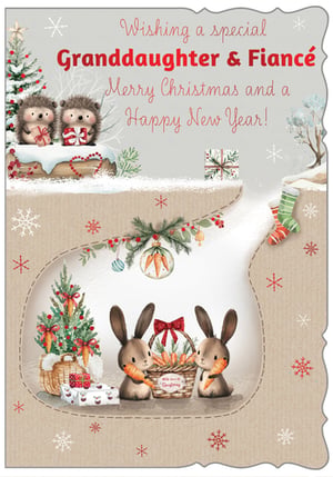 Send extra special festive cheer to your Granddaughter and her Fiancé with this utterly charming Christmas card! Adorned with adorable hedgehogs nestled in a snowy wonderland and sweet bunnies enjoying their festive carrots, this card is a true delight. The heartwarming message inside wishes them a very Merry Christmas and a Happy New Year. With its whimsical design and lovable characters, it’s the perfect way to share your warmest wishes and bring a smile to their faces this holiday season. Crafted with care, this beautiful card from Out of The Blue Studios Ltd captures the magic of Christmas.