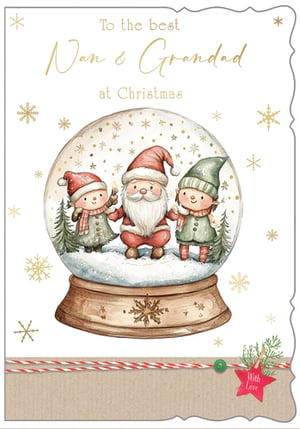 Bring festive cheer to your shelves with this delightful 'Nan & Grandad' Christmas card from Out of The Blue Studios Ltd. This charming card features a heartwarming watercolour illustration of Santa Claus holding hands with two adorable elves inside a magical snow globe, surrounded by shimmering snowflakes. The elegant gold script wishes 'To the best Nan & Grandad at Christmas', making it an ideal choice for customers looking to send love to their beloved grandparents. Beautifully finished with a rustic kraft paper detail, complete with red and white baker's twine and a 'With Love' tag, this card truly captures the spirit of the season. Available in a convenient pack size of 1x6, it's a wonderful addition to your Christmas card selection.