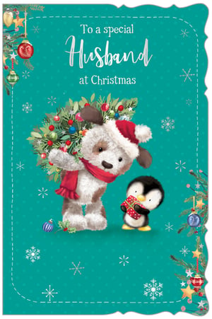 Make Christmas extra special for your customers' husbands with this delightful card from Out of The Blue Studios Ltd. This charming design features an adorable fluffy dog, complete with a Santa hat and red scarf, carrying a festive wreath, accompanied by a sweet little penguin holding a wrapped gift.
The heartfelt message, "To a special Husband at Christmas," is beautifully presented on a vibrant teal background, adorned with delicate snowflakes and classic Christmas foliage. With its cute characters and warm sentiment, this card is perfect for expressing love and festive cheer. Each pack contains 6 high-quality cards, ready to brighten up your Christmas card selection.
