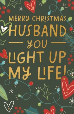 Help your customers celebrate their wonderful husbands this Christmas with this charming card from Paper Rose. Set against a festive dark green backdrop, the card features a heartfelt message in shimmering gold lettering: 'MERRY CHRISTMAS HUSBAND YOU LIGHT UP MY LIFE!'.
The design is beautifully enhanced with delightful illustrations of classic Christmas elements, including vibrant holly, red berries, twinkling fairy lights, and sweet, loving hearts. This thoughtful and festive card is perfect for expressing deep affection during the holiday season. Stock up on this popular design, available in a convenient pack of 6, to ensure your customers can find the perfect way to show their love.
