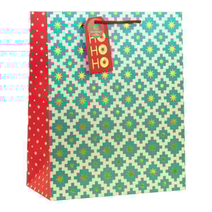 Make your gifts shine with our Large Geo Star Gift Bag! This eye-catching bag features a stylish geometric pattern in teal and cream, adorned with shimmering gold stars. A vibrant red side panel with delicate white stars and matching red handles adds a festive touch. Each bag comes with a charming "HO HO HO" gift tag, proudly highlighting its eco-friendly and 100% recyclable credentials. Perfect for Christmas or any special occasion, these large bags are ideal for presenting generous gifts. Available in a convenient wholesale pack of 6 from Partisan Products Ltd.
