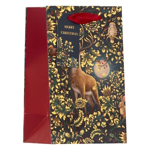 Elevate your Christmas gifting with our enchanting Small Enchanted Forest Gift Bag. This beautiful bag showcases a captivating design featuring a majestic deer, a wise owl, and a charming rabbit nestled amongst intricate gold foil foliage and festive red berries, all under a luminous moon. The deep, rich background is perfectly accented by the shimmering gold details, creating a truly magical presentation. Each bag is finished with a "MERRY CHRISTMAS" gift tag and a luxurious red ribbon handle. Ideal for smaller treasures, these bags promise to add a special touch to any present. Supplied by Partisan Products Ltd, they come in a convenient pack of 6, making your holiday preparations effortless.