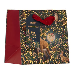 Make every gift extra special this Christmas with our enchanting Extra Small Enchanted Forest Gift Bag. This beautiful bag features a captivating design of a majestic deer, a wise owl, and a charming rabbit nestled within a shimmering golden forest, all illuminated by a serene moon. The rich, dark background is adorned with intricate foliage and festive red berries, creating a truly magical scene. Each bag is finished with a "Merry Christmas" gift tag and a luxurious red ribbon handle, adding a touch of elegance. Perfect for smaller treasures, these bags are sure to delight. Available in a handy pack of 6, they're an essential addition to your festive offering.