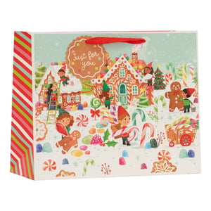 Bring a touch of festive magic to your customers' gifts with our delightful Large Elf Village Shopper Gift Bag! Perfect for the holiday season, this charming bag features a whimsical scene of busy elves in their gingerbread village, surrounded by an abundance of colourful sweets, candy canes, and festive treats.

The vibrant design, complete with a 'Just for you' gingerbread tag, makes every present feel extra special. Its generous size is ideal for accommodating a variety of gifts, while the red handles offer comfortable carrying. The playful striped side panels add to its cheerful appeal.

Supplied by Partisan Products Ltd in a convenient pack of 6, these bags are a wonderful addition for any retailer looking to offer enchanting gift packaging this Christmas.