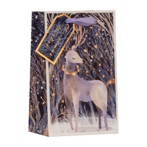 Introduce a touch of enchantment to your festive offerings with our Small Magical Reindeer Gift Bag. This delightful bag features a serene reindeer amidst a snowy, moonlit forest, adorned with shimmering golden stars and elegant foil accents. The rich, deep blue and purple hues create a truly magical winter wonderland scene, making every gift feel extra special. A charming gift tag with a purple ribbon completes the premium look. Perfect for small Christmas presents, this bag is sure to captivate your customers and add a touch of sparkle to their holiday gifting. Available in a convenient pack of 6 from Partisan Products Ltd.