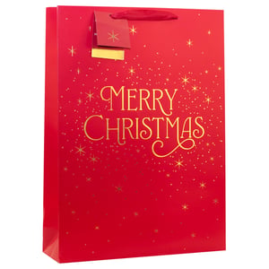 Present your Christmas gifts in style with our Extra Large Merry Christmas Gift Bag. This generously sized bag boasts a vibrant red finish, beautifully adorned with elegant gold 'Merry Christmas' script. A scattering of shimmering gold stars and festive dots adds a touch of sparkle, making every present feel special.

Complete with sturdy red ribbon handles and a coordinating gift tag, it's the perfect solution for larger items. Offer your customers a truly delightful way to share their festive cheer. These high-quality bags are supplied in a convenient pack of 6, ready to brighten any holiday display.