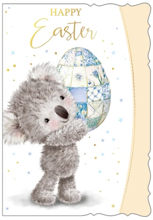 Bring a touch of adorable charm to your Easter collection with our 'Open Easter' card, from Out of The Blue Studios Ltd. This delightful design features a super cute, fluffy koala bear lovingly holding a beautifully patterned Easter egg. The egg boasts an intricate patchwork design in lovely shades of blue, white, and cream, adorned with delicate florals and geometric patterns. Golden "Happy Easter" script adds a festive touch, complemented by scattered gold dots and blue stars. This charming card is perfect for sending warm wishes and is sure to bring a smile. Available in a convenient pack size of 1x6, it's an ideal choice for retailers seeking engaging and high-quality Easter greetings.
