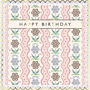 Celebrate her special day with this exquisitely designed Happy Birthday card. Featuring a charming vintage-inspired floral pattern, this card boasts delicate blue and rich brown flowers intertwined with graceful green leaves and sweet bows. Soft pink wavy stripes adorned with tiny dots create a beautiful backdrop, all framed by an elegant scalloped border with subtle gold accents. The classic 'Happy Birthday' message, presented in sophisticated gold lettering, makes this an ideal choice for any female recipient. Its timeless appeal and gentle colour palette ensure it will bring a smile to her face. A truly lovely way to send your warmest wishes.