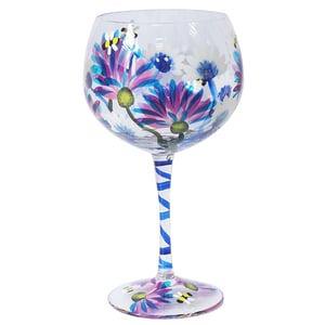 Discover the charm of our Thistles & Bees Gin Glass, a beautiful addition to any drinkware collection from Lesser and Pavey Ltd. This generously sized gin glass features an eye-catching hand-painted design, showcasing vibrant purple and blue thistle-like flowers. Delicate bees are depicted buzzing amongst the petals, adding a whimsical touch.
The clear stem is elegantly wrapped with a blue spiral pattern, leading to a sturdy base adorned with more floral and bee details. Ideal for enjoying your favourite gin and tonic, this glass brings a lovely splash of colour and character to any gathering. It's also a thoughtful gift for gin lovers. Each glass is supplied individually, ready to delight.
