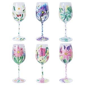 Introduce a splash of vibrant artistry to your customers' homes with these delightful Hand Painted Wine Glasses 6 Asstd from Lesser and Pavey Ltd. This charming collection features six uniquely designed glasses, each meticulously hand-painted with beautiful floral and nature-inspired motifs.
From delicate white blossoms with a playful ladybug to striking purple thistles, graceful dragonflies, and cheerful pink flowers adorned with butterflies, every glass offers a distinct and captivating design. The coordinating painted stems and bases add an extra touch of elegance and whimsy. Perfect for special occasions, everyday enjoyment, or as truly thoughtful gifts, these glasses are sure to become a cherished addition to any collection. Available in a convenient pack size of 1x6, they are ready to brighten up your shelves and delight your clientele.