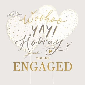 Help your customers celebrate those exciting engagement announcements with this charming card from Ling. This delightful design features two elegant heart-shaped balloons, beautifully decorated with shimmering gold speckles and tiny hearts. Playful script in gold and grey exclaims "Woohoo", "YAY!", and "Hooray", perfectly capturing the joy of the occasion. Two sweet birds add a delicate touch at the top, while the bold gold lettering proudly declares "YOU'RE ENGAGED". It's the perfect way to share in the happiness of a newly engaged couple. Available in a convenient pack of 6, this card is a must-have for your special occasion section.