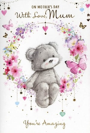 Show Mum just how amazing she is this Mother's Day with this truly heartwarming card from Simon Elvin. This delightful design features an adorable grey teddy bear, lovingly surrounded by a vibrant wreath of watercolour flowers in shades of pink, purple, and yellow. Delicate butterflies flutter gracefully, while charming hanging hearts and stars add a touch of sparkle. With the sweet messages 'ON MOTHER'S DAY With Love, Mum' and 'You're Amazing', this card beautifully expresses affection and appreciation. Perfect for retailers looking to offer a popular and touching option for their customers. Supplied in a convenient pack of 6 (1x6).