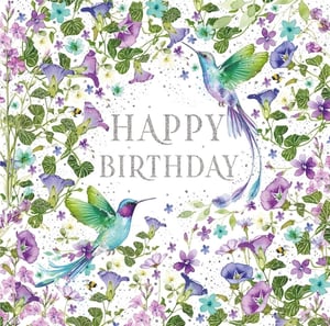 Celebrate special birthdays with this enchanting 'Open Birthday Female' card from Nigel Quiney Publications. This exquisite design features two magnificent hummingbirds, their iridescent wings shimmering amidst a vibrant tapestry of delicate purple, blue, and white wildflowers. Tiny bees flit among the blossoms, adding a touch of natural charm. The sparkling 'HAPPY BIRTHDAY' message takes centre stage, making this card truly stand out. Perfect for any female recipient, its beautiful artistry and serene feel are sure to delight. Each wholesale pack contains 6 cards, ready to bring joy to your customers.