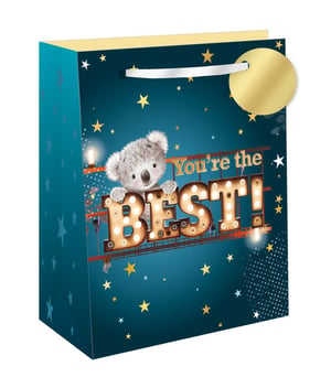 Make someone's day truly special with our charming Extra Large You're The Best Gift Bag! This delightful design features an adorable koala peeking over dazzling marquee-style 'BEST!' lettering, perfectly complemented by the heartfelt "You're the" message.
The deep teal background, adorned with twinkling gold stars and warm light accents, creates a wonderfully celebratory feel. Ideal for birthdays, thank yous, or simply showing appreciation, its generous extra-large size is perfect for accommodating a variety of thoughtful gifts. Complete with a sturdy white ribbon handle and a stylish gold gift tag, it adds a touch of elegance to any present.
Stock up on this popular design; available in a convenient pack of 6 from Out of The Blue Studios Ltd.