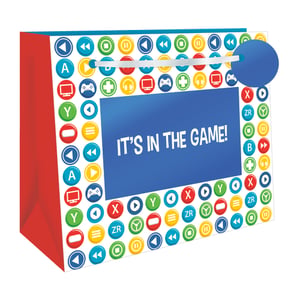Level up your gift-giving with our Extra Large 'It's In The Game!' Shopper Gift Bag! Designed for gaming fans of all ages, this vibrant bag boasts a fantastic array of colourful controller buttons, media icons, and classic gaming motifs. The bold "IT'S IN THE GAME!" slogan proudly takes centre stage, making it an exciting choice for birthdays, holidays, or any special occasion. Its extra-large size ensures ample space for all those fantastic presents. Available in a convenient pack of 6, these eye-catching bags are a must-have for your retail offering. From Out of The Blue Studios Ltd., give your customers the ultimate gaming-themed gift solution!