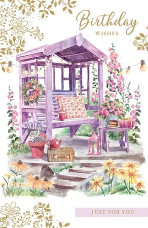 Send warm birthday greetings with this delightful card, featuring a charming watercolour illustration. The design depicts a peaceful garden setting, centred around a lavender-hued arbour. This inviting space includes a swing seat with a patterned cushion, adorned with string lights and a pretty floral wreath. Lush pink and yellow flowers bloom around the scene, adding a touch of natural beauty. A small table, set with a birthday cake and gifts, suggests a lovely celebration. With 'Birthday Wishes' at the top and 'Just For You' at the bottom, this card offers a thoughtful way to mark a special occasion for any female friend or family member. It's a lovely choice for a memorable birthday.