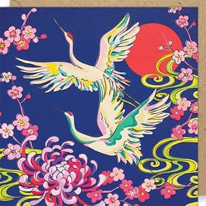 Introduce your customers to this truly stunning Blank Female card from Paper Rose, featuring an exquisite design inspired by traditional Japanese art. Two majestic cranes soar gracefully against a deep, rich blue background, with a vibrant red sun adding a striking focal point. Delicate cherry blossoms in shades of pink and a magnificent chrysanthemum burst with colour, complemented by elegant swirling patterns in green and yellow. This captivating card offers ample space for a personal message, making it perfect for a wide variety of occasions. Each wholesale pack contains 6 beautiful cards, ready to add a touch of elegance to your retail offering.