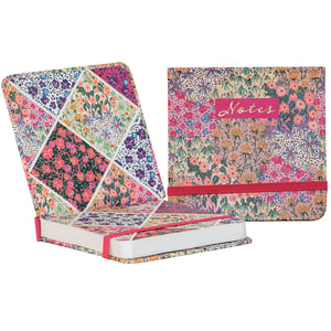 Introduce the delightful Liberty Garden Mini Jotter, a charming and practical addition to any stationery collection. This vibrant mini notebook features a beautiful patchwork of intricate floral designs, bursting with a variety of colours. It's perfectly sized for jotting down thoughts, reminders, or creative ideas, making it an ideal companion for on-the-go use. The sturdy cover, clearly labelled 'Notes', is secured with a bright pink elastic band, keeping your pages neat and protected. Each jotter offers a lovely blend of functionality and eye-catching design. Available as singles from Partisan Products Ltd, it’s a wonderful item for personal use or as a thoughtful gift. Add a touch of floral elegance to your day with this appealing mini jotter.