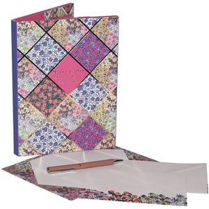 Introduce your customers to the enchanting Liberty Garden Writing Set, a beautiful celebration of classic design. This exquisite single set is presented in a sturdy folder, adorned with a vibrant patchwork of intricate floral patterns. Each colourful square, framed by elegant gold lines, creates a truly captivating display.
Inside, discover everything for heartfelt correspondence: a sleek, rose gold pen, accompanied by high-quality writing