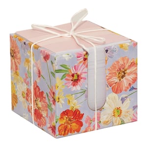 Add a touch of floral charm to any workspace with our Saffron Memo Block. From Partisan Products Ltd., this delightful memo block is adorned with a vibrant array of painted flowers in shades of pink, orange, and yellow, set against a soothing lavender backdrop. The artistic design brings a burst of colour and elegance to your desk. Each block comes beautifully tied with a delicate white ribbon, making it a perfect little gift or a cheerful addition to your own stationery collection. With a convenient cut-out for easy access, you'll always have a fresh sheet ready for those important notes and reminders. This single memo block is as practical as it is pretty.