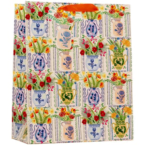 Present gifts beautifully with our Large Seville Gift Bag. This eye-catching bag features a vibrant, folk-inspired pattern of colourful floral arrangements in charming, intricately designed vases. A rich palette of reds, yellows, and blues against a patterned cream background evokes a delightful Mediterranean aesthetic, perfect for adding a touch of warmth and artistry to any present.
Its generous dimensions make it suitable for a wide range of gifts, offering great versatility for your customers. Crafted with sturdy materials and finished with elegant orange ribbon handles, this bag ensures a premium presentation. Available in a convenient pack of 6, sourced from Partisan Products Ltd, it's an excellent choice for your retail offering.