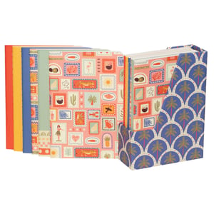 Bring a burst of sunshine to your stationery collection with our 6 Sunshine A6 Notebooks With Stand. This vibrant set features six A6 notebooks, each adorned with a playful, tropical-inspired 'stamp' pattern on a cheerful pink background. Discover charming illustrations of flamingos, tigers, cacti, and more, all ready to inspire your thoughts.
The colourful spines add an extra touch of joy, while the included matching stand, boasting a stylish blue palm tree design, keeps your notebooks perfectly organised and accessible. Ideal for jotting down ideas on the go or adding a delightful splash of fun to any desk. A wonderful gift or a lovely treat for yourself!