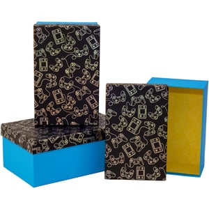 Discover the ultimate storage solution for gaming enthusiasts with our Gamer 3 Nested Boxes. This fantastic set includes three beautifully designed boxes, perfect for tidying up or presenting gifts in style.

Each box features a striking black exterior adorned with an iridescent pattern of classic gaming controllers and handheld consoles. The vibrant blue base and a surprise sunny yellow interior add a playful touch. These versatile nested boxes are a must-have for any gamer's space, offering both practicality and a cool aesthetic. Sold as a single set of three.