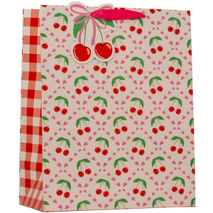 Add a burst of cheerful style to your retail offering with our Large Cherries Gift Bag from Partisan Products Ltd. This delightful bag features a vibrant all-over pattern of red cherries and green leaves, complemented by a charming pink heart motif background. The side panel showcases a classic red and white gingham check, adding a touch of retro appeal.
A sweet die-cut cherry cluster with a pink bow adorns the top, perfectly matched with bright pink ribbon handles. Ideal for birthdays, summer events, or any occasion that calls for a fun and fruity presentation. Stock up with our convenient pack of 6.