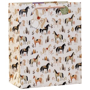 Gallop into gifting with our delightful Large Pony Trek Gift Bag! This charming bag features an enchanting pattern of elegant ponies in various colours, gracefully set amongst autumnal foliage and rustic trees. The warm, earthy palette makes it a versatile choice for birthdays, special occasions, or simply to add a touch of equestrian charm to any present.
Crafted with sturdy rope handles for easy carrying, this bag also proudly displays its eco-friendly credentials, being 100% recyclable. Perfect for customers who appreciate beautiful design and sustainability. Available in a convenient pack of 6.