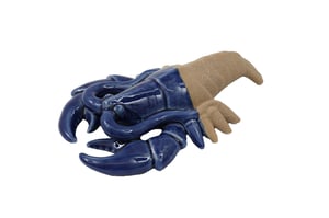 Bring a touch of coastal charm to any space with our stunning 23cm Lobster Deco. This unique decorative piece features a beautifully crafted, glossy deep blue ceramic front, contrasting wonderfully with a textured, sandy-effect rear. Perfect for adding a nautical flair to shelves, side tables, or windowsills, it's an eye-catching accent that evokes seaside serenity. Whether for a beach house aesthetic or simply to brighten a room, this charming lobster ornament is sure to delight. Sold individually, it makes an ideal gift or a lovely addition to any home decor collection.