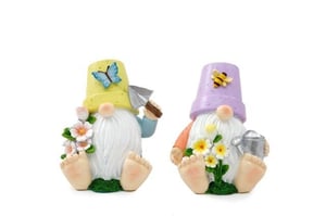 Bring a touch of whimsical charm to your store with our delightful 14.5cm Flower Pot Hat Gnomes! This adorable duo features two unique designs, perfect for adding a sprinkle of magic to any garden or home decor collection. Each gnome boasts a long white beard, a sweet pink nose, and bare feet, sitting happily on a patch of green grass.
One gnome wears a sunny yellow flower pot hat adorned with a blue butterfly, holding a trowel and a bouquet of pink blooms. Its companion sports a lovely lilac flower pot hat with a busy bee, clutching a watering can and surrounded by cheerful yellow and white flowers. These enchanting gnomes are sold in a convenient pack of 1x2, making them an ideal addition to your spring and summer offerings. From Sifcon International PLC, these charming figures are sure to bring smiles.