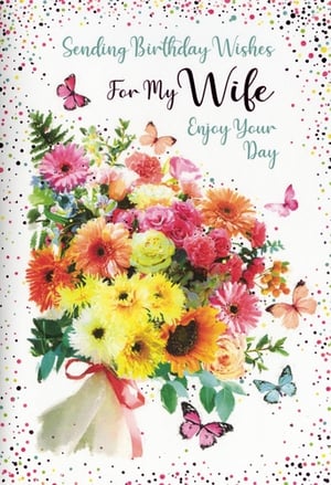 Presenting the 'Wife' Birthday Card, a truly beautiful way to celebrate her special day. This exquisite design features a stunning, vibrant bouquet bursting with colourful flowers like gerberas and sunflowers, complemented by delicate butterflies fluttering around. The heartfelt message, 'Sending Birthday Wishes For My Wife Enjoy Your Day', is elegantly scripted, making it the perfect choice to convey love and joy. Crafted with care by Simon Elvin, these delightful cards are available in convenient packs of six, ensuring you're well-stocked for your customers seeking that perfect, cheerful card for their beloved wives.